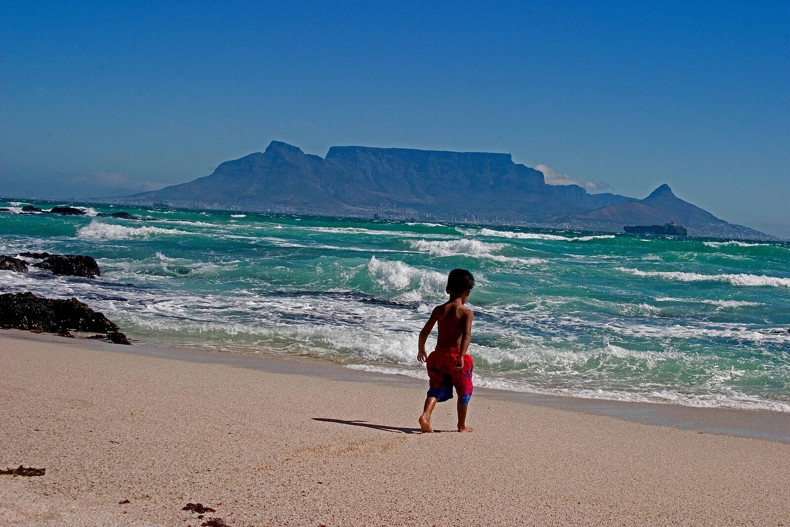 Table Mountain seen across the ocean from Bloubergstrand beach, Cape Town